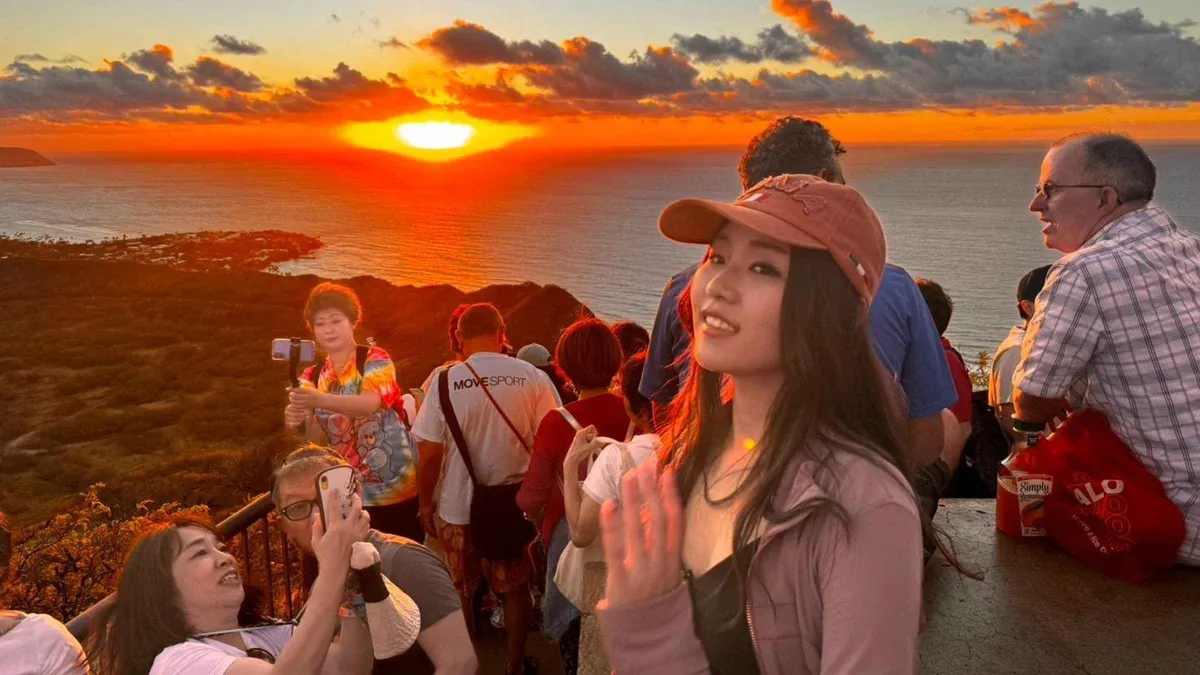 Sunrise from the Diamond Head summit over Waikiki on a guided Oahu volcano tour crater hike, Hawaii